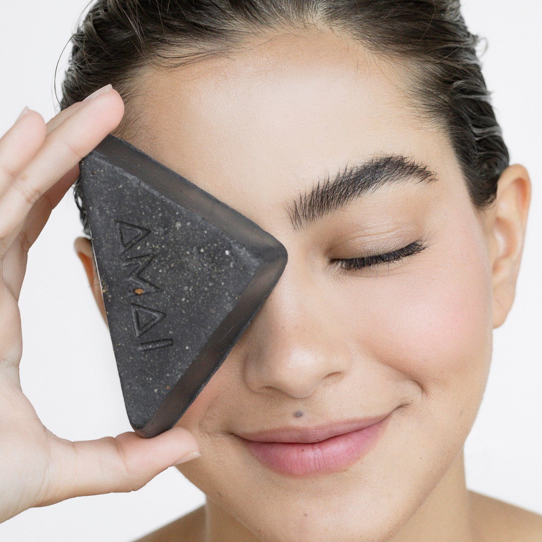 Woman exfoliating skin face activated soap in natural bar