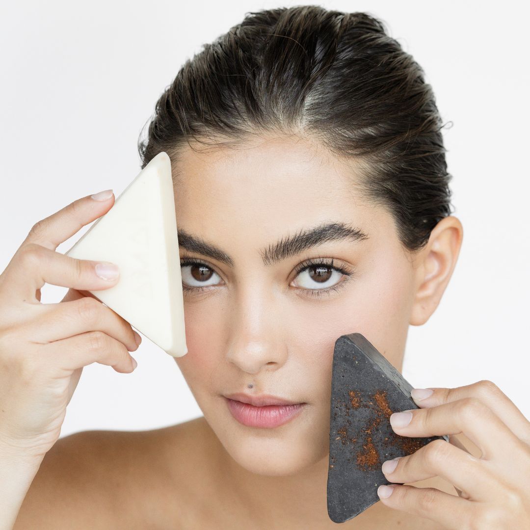 Woman with facial makeup remover and activated charcoal facial scrub