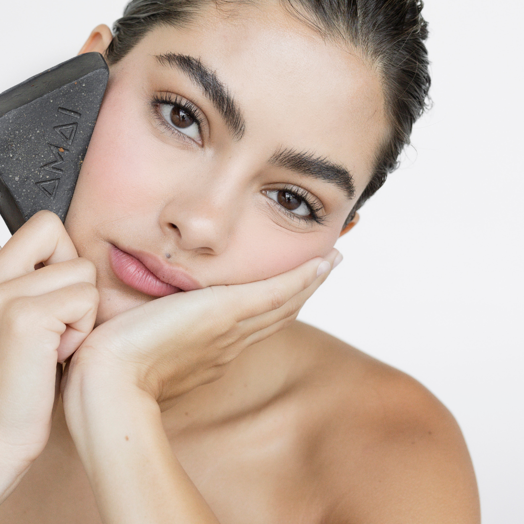 Woman with acne facial scrub soap