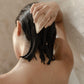 Woman washing her hair with shampoo bar