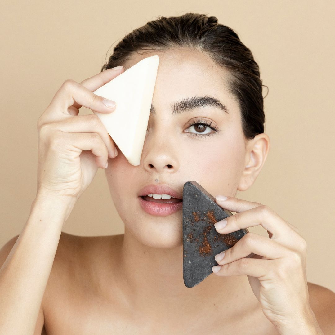 Woman with natural makeup remover bars and facial soap